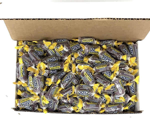 Top view of open box packed with individually wrapped Jolly Rancher Grape hard candy